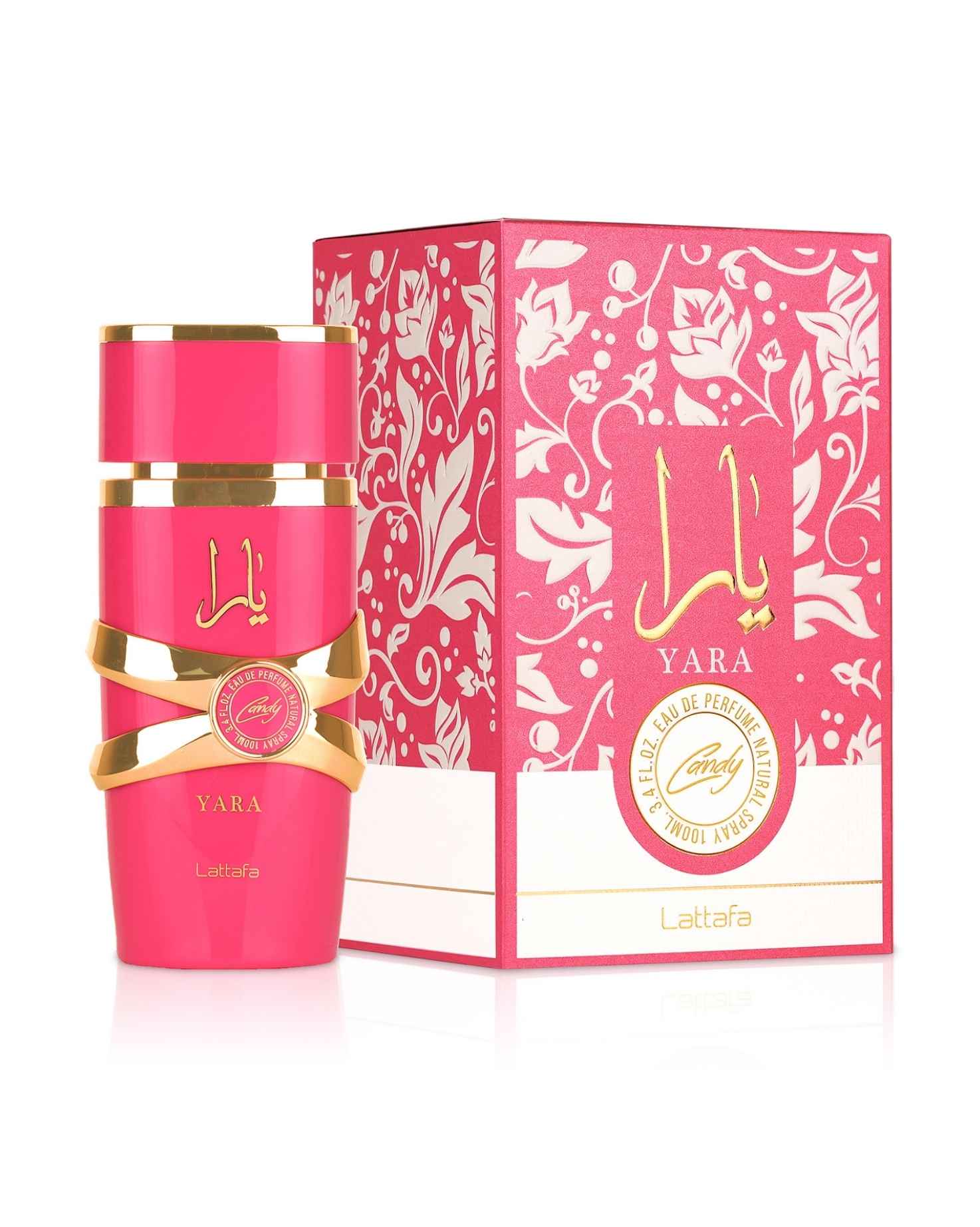 The hot pink and gold bottle of Lattafa Yara Candy perfume standing next to its decorative floral patterned pink and white box.