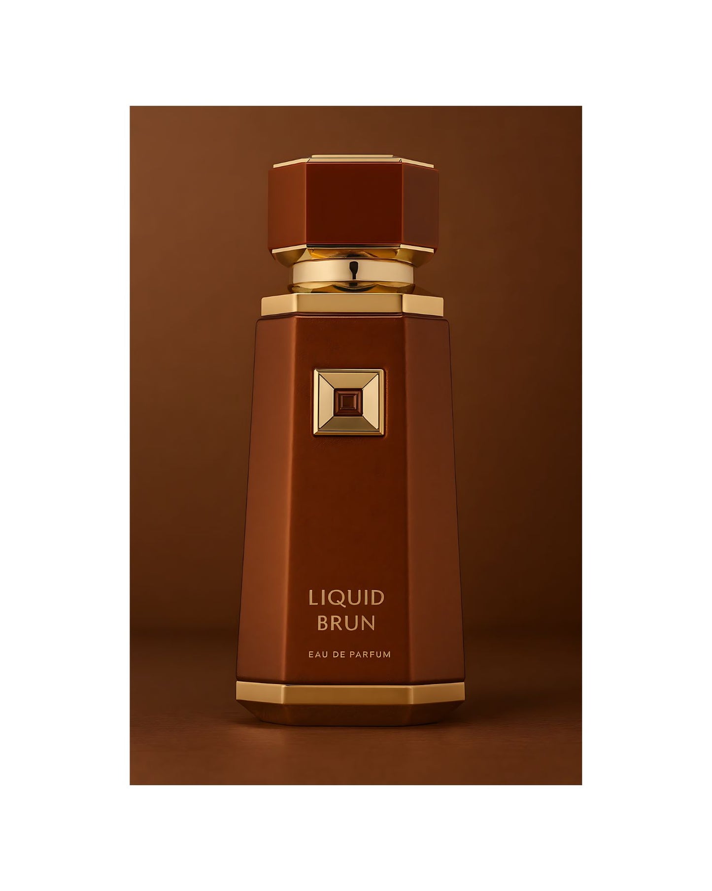 A tall, brown perfume bottle with 'Liquid Brun Eau de Parfum' text and a gold octagonal cap. The bottle features a central gold plaque with a dark amber jewel.