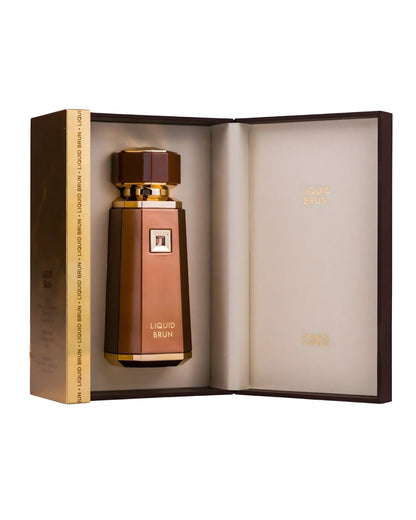 The Liquid Brun Eau de Parfum bottle, brown and gold, is nestled securely inside its open, dark brown presentation box. The inside of the box is lined with a light cream material, and the inner lid displays the 'Liquid Brun' logo.The Liquid Brun Eau de Parfum bottle, brown and gold, is nestled securely inside its open, dark brown presentation box. The inside of the box is lined with a light cream material, and the inner lid displays the 'Liquid Brun' logo.