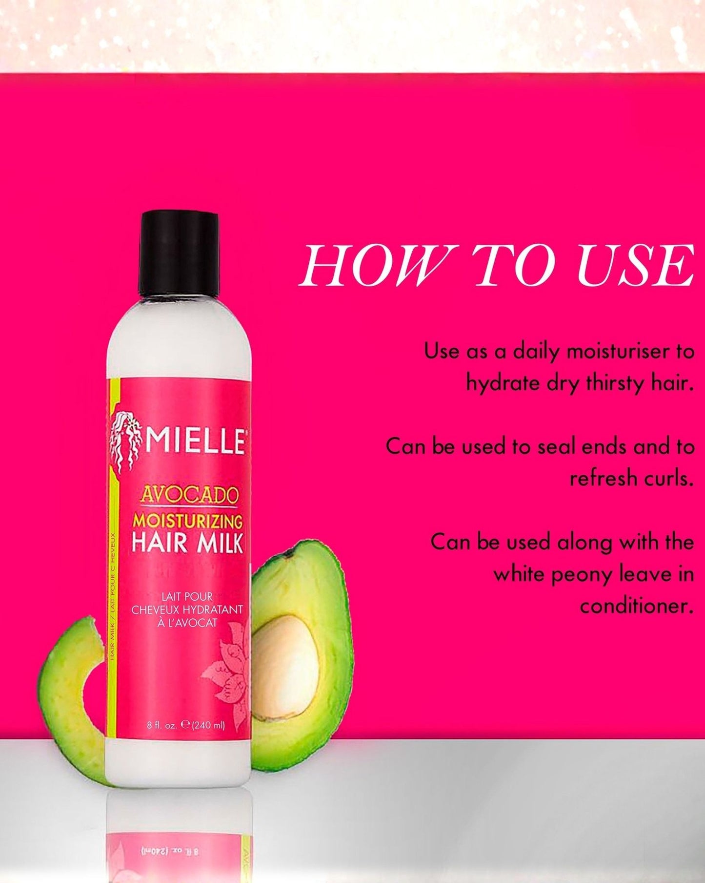 An image showing a bottle of Mielle Avocado Moisturizing Hair Milk next to a cut avocado half. The right side of the pink background lists the text 'HOW TO USE' followed by three points: Use as a daily moisturizer to hydrate dry thirsty hair; Can be used to seal ends and to refresh curls; Can be used along with the white peony leave in conditioner.