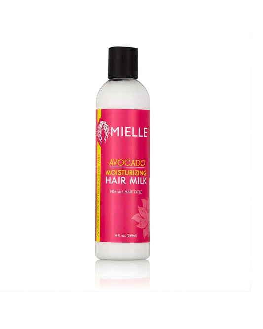 A bottle of Mielle Avocado Moisturizing Hair Milk for all hair types. The white bottle has a pink label with yellow and black text, and a black cap.