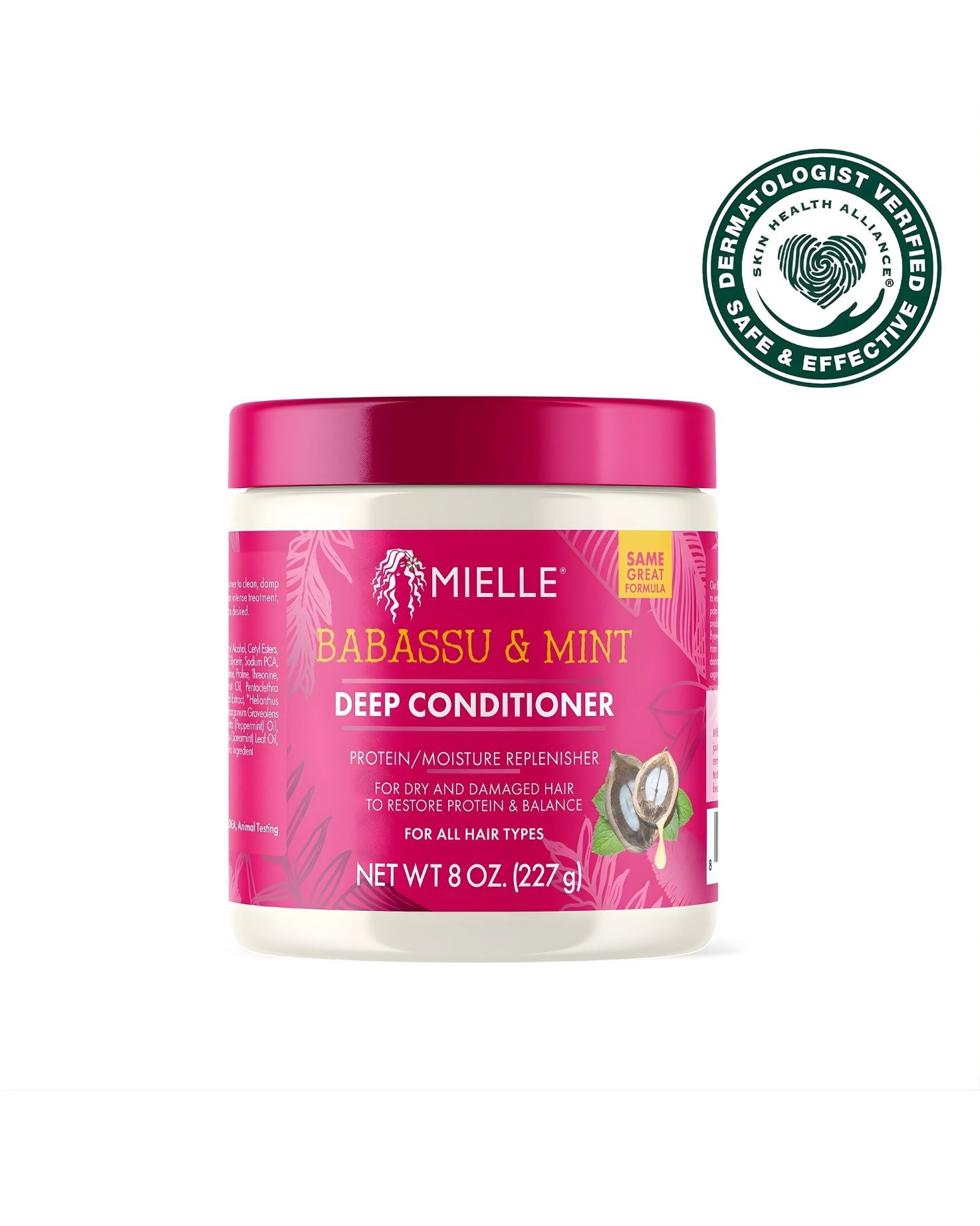 A white jar of Mielle Babassu & Mint Deep Conditioner, a protein/moisture replenisher for dry and damaged hair. The jar has a bright pink label and a pink lid. In the upper right corner, there is a 'Dermatologist Verified Skin Health Alliance Safe & Effective' seal.