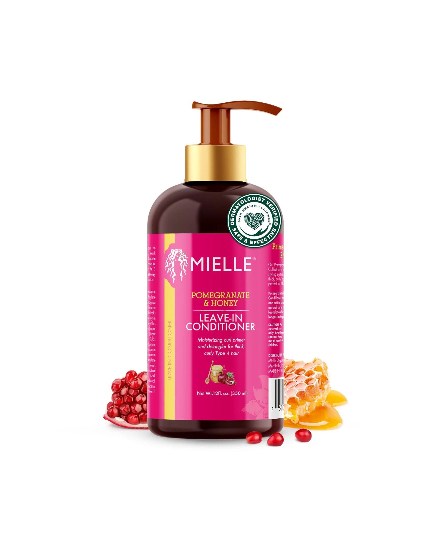 A black pump bottle of Mielle Pomegranate & Honey Leave-In Conditioner with a bright pink label. The label highlights the product's function to 'Maintain curl pattern and detangle for thick, curly Type 4 hair.' The bottle is framed by fresh pomegranate seeds and a piece of dripping honeycomb, isolated on a white background.