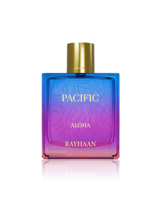 A rectangular glass bottle of Rayhaan Pacific Aloha perfume with a vibrant blue, purple, and pink gradient design and a gold cap.