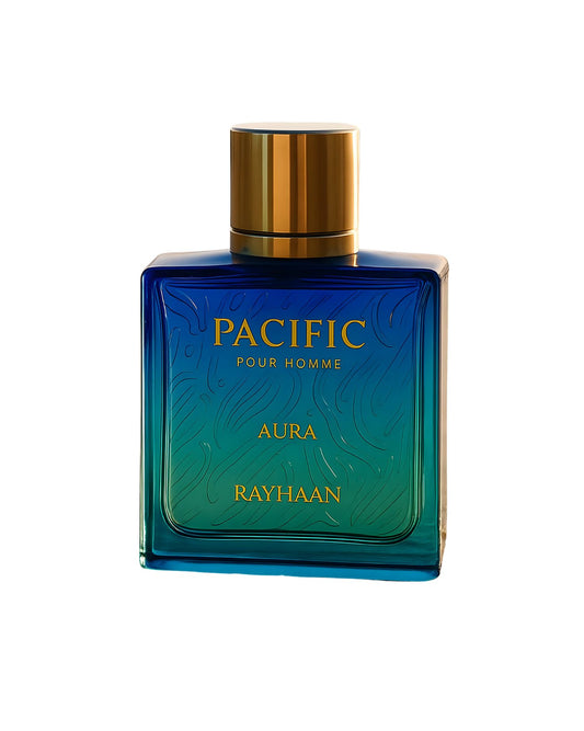 Square perfume bottle with a vibrant blue-to-teal ombre gradient, suggesting ocean water. It has a metallic gold cap and the text "PACIFIC," "POUR HOMME," "AURA," and "RAYHAAN" in gold lettering.