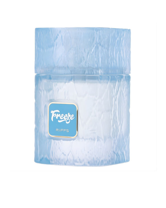 A short, cylindrical glass jar or bottle with a light blue, icy, textured finish. The label in the center is a pale blue rectangle bordered in gold, featuring the word Freeze Extrait de parfum in white script above the brand name "RIIFFS". The texture resembles cracked or frozen ice.