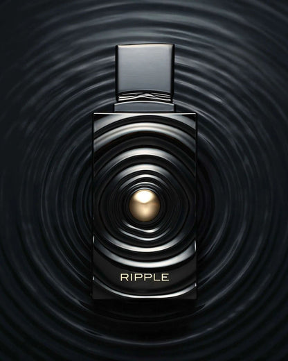 Creative product photography of Ripple edp french avenue luxury fragrance, showing the black and gold bottle seamlessly blending into a dark liquid ripple background.