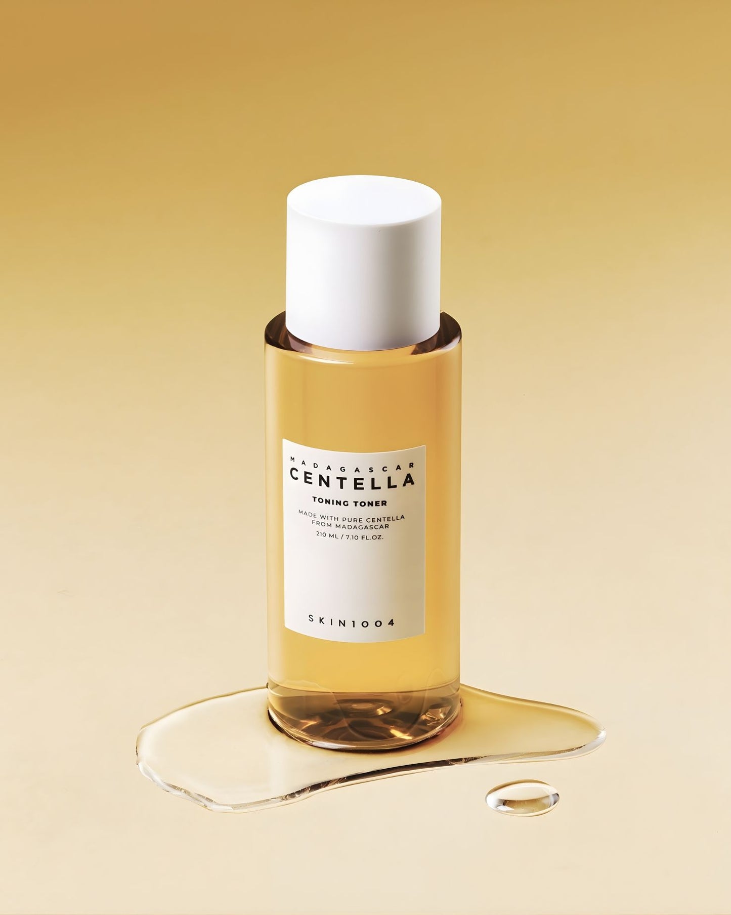 Small clear glass dropper bottle (30 mL) of SKIN 1004 Centella Tone Brightening Capsule Ampoule, showing the visible small white capsules suspended in the liquid.