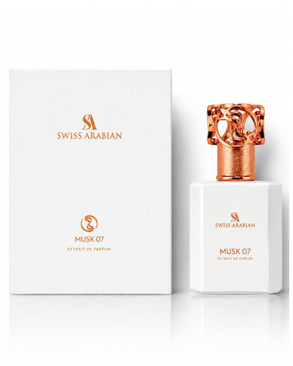 Swiss Arabian Musk 07 Extrait de Parfum white bottle standing next to its white and rose gold packaging box.